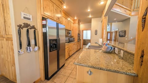 The galley style Kitchen with stainless steel appliances