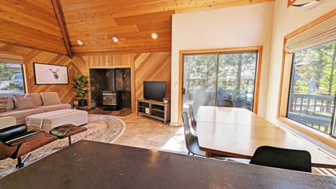 The Dining area sits next toa sliding glass door that leads to the deck.