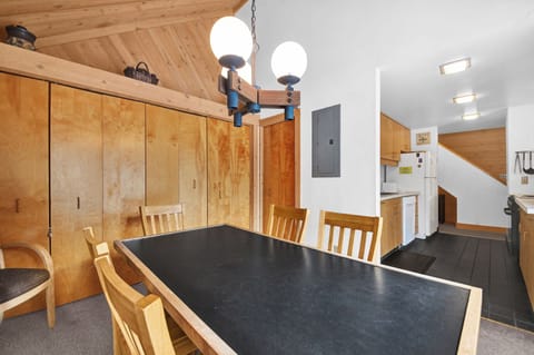 The closet behind holds the stack washer and dryer