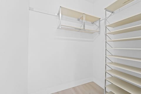 Spacious Walk In Wardrobe with Organized Storage for All Your Belongings