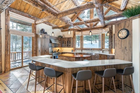 A remodeled chef's kitchen with 48 inch stove