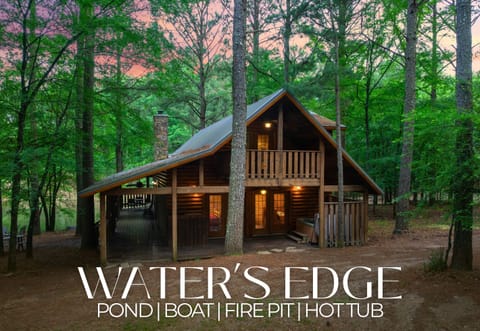 Water’s Edge cabin: pond, boat, hot tub, and fire pit. 3 bedrooms, 2 baths, and endless outdoor fun. Sleeps 8.