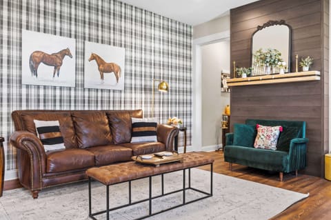 Living Room: Every detail thoughtfully chosen for your comfort. From the plush leather seating to the charming decor, our living room is a sanctuary waiting for you to make memories. 