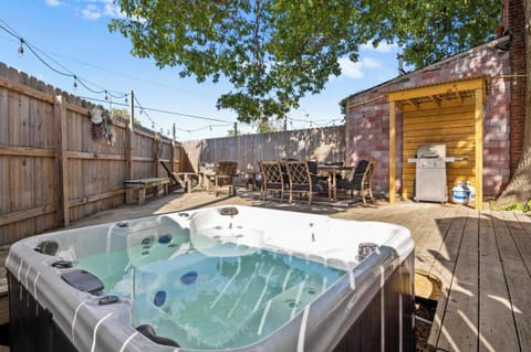 Backyard: Get ready to entertain or simply chill out! Our expansive outdoor deck features a bubbling hot tub and comfortable seating, perfect for evening conversations or soaking up the sun. Fun in the sun (or stars!) is guaranteed!