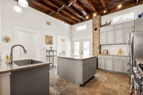 Spacious and well-lit space for cooking and socializing.