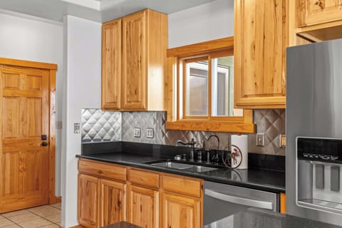 Kitchen: Main floor, Drip coffee maker, Crockpot, French press, toaster, cooking utensils, tableware