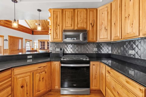 Kitchen: Main floor, Drip coffee maker, Crockpot, French press, toaster, cooking utensils, tableware