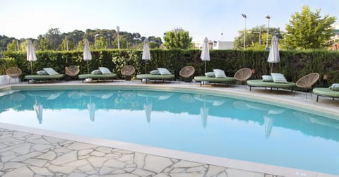 Outdoor pool, open 10:00 AM to 8:00 PM, pool umbrellas, sun loungers