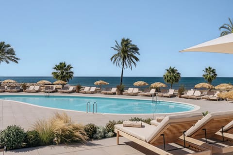 Outdoor pool, pool umbrellas, sun loungers