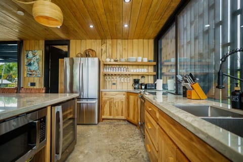 From the high-end appliances to the custom cabinetry and unique pendant lighting, every detail ensures a delightful cooking and dining experience.