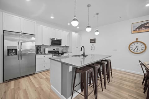 Cook, chat, and dine together—open kitchen and space for the whole crew!