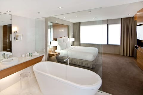 Suite, 1 King Bed | Bathroom | Eco-friendly toiletries, hair dryer, bathrobes, slippers