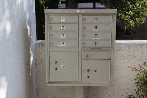 Secure exterior mailboxes with package delivery boxes.