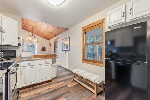Kitchen: Main floor, drip coffee maker, blender, toaster, cooking utensils, tableware