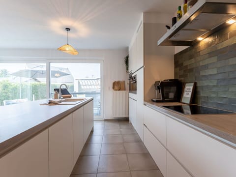 Kitchen, Countertop, Interior Design, Flooring, Cabinetry, Wood, Floor, Ceiling, Light Fixture, Kitchen Appliance