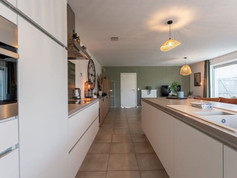 Kitchen, Countertop, Interior Design, Flooring, Cabinetry, Wood, Light Fixture, Ceiling, Furniture, Kitchen Appliance