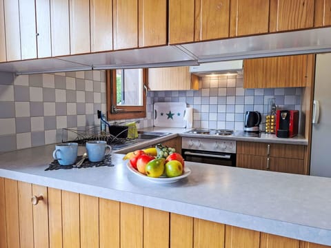 Kitchen, Countertop, Kitchen Appliance, Cabinetry, Flooring, Interior Design, Major Appliance, Wood, Kitchen Sink, Furniture