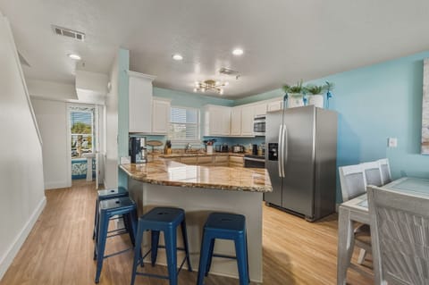 Hallway to half bath and 3rd floor from the living area.