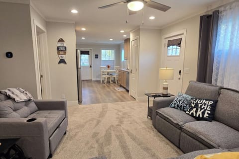 Spacious open-concept living area with Smart TV and comfortable seating for six—perfect for relaxing after a day by the lake