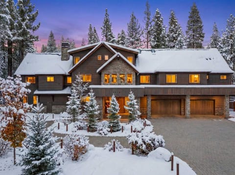 Exterior: Front entrance with covered portico, circular driveway, landscaped grounds, on-site parking for 10 vehicles (2 in garage, 8 in driveway)
