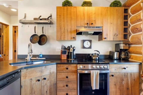 Kitchen: Drip coffee maker, toaster, cooking utensils, tableware