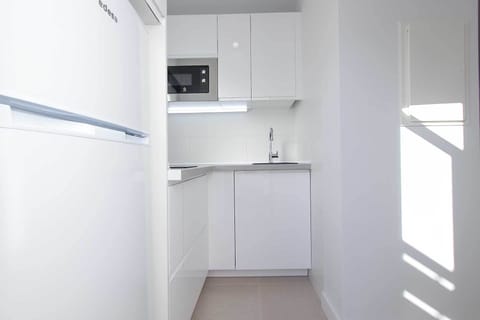 Comfort Apartment, Garden View | Private kitchen | Full-size fridge, microwave, stovetop, cookware/dishes/utensils