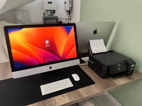 Dedicated workspace with 2 x 27 inch imac computers, ecotank printer, and high speed wifi. Perfect for remote work, study, or managing personal tasks while enjoying your holiday.