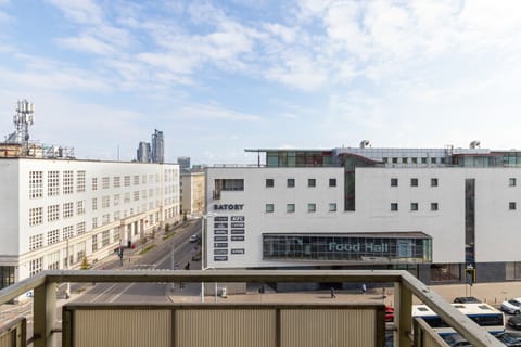 The balcony's stylish design complements the apartment's decor.