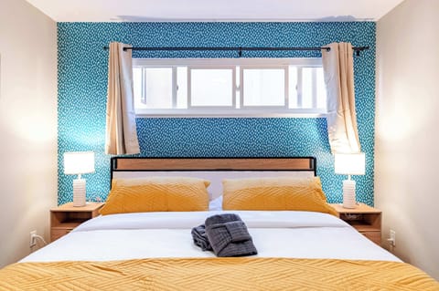 Spacious bedroom with a comfortable king bed, soft linens, and a relaxing atmosphere.