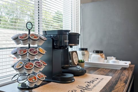 Fully stocked coffee bar with a variety of K-Cups and essentials, this is a warm welcome for every caffeine lover.