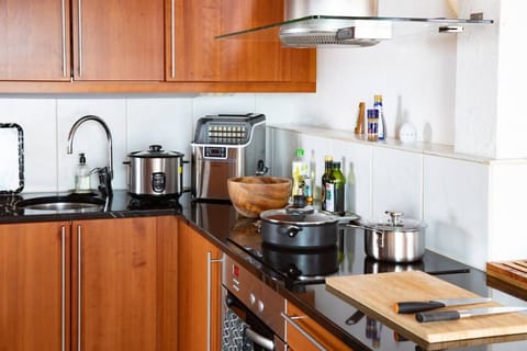 Cook your favourite meals with ease in this modern kitchen, complete with quality cookware, handy appliances, and plenty of space to prepare and enjoy your dishes.