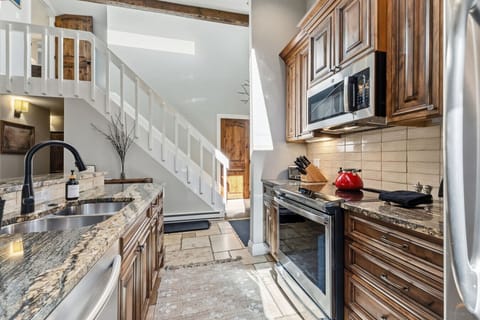 Fully equipped kitchen with bar seating