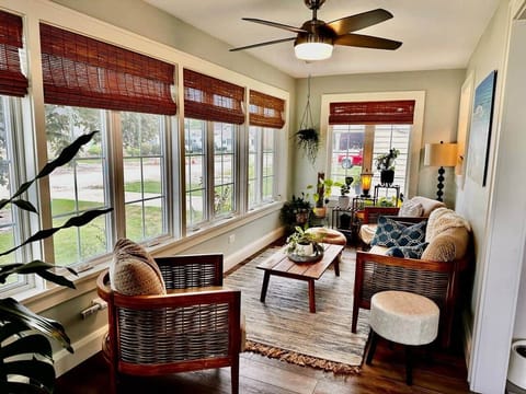 Sunroom on main floor in front of home off of living room