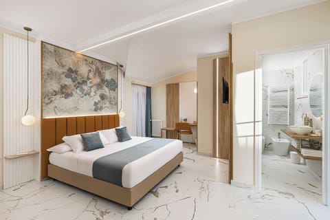 Deluxe Suite, Balcony, City View | In-room safe, blackout drapes, soundproofing, iron/ironing board