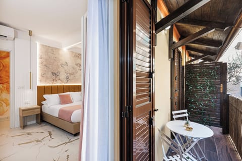 Deluxe Double Room, Balcony, Courtyard View | In-room safe, blackout drapes, soundproofing, iron/ironing board