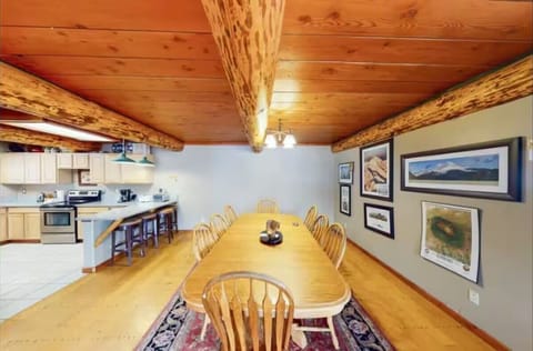 Dining area: Main floor, table seating for 9, 3 barstools, patio access