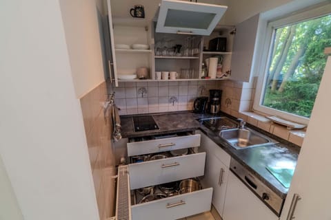 Fully equipped kitchen with dishwasher, and full-size fridge
