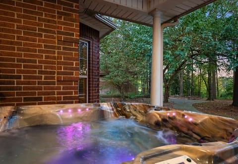 Relax in the private hot tub surrounded by nature.