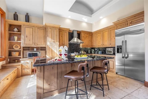 Kitchen: Third floor, drip coffee maker, toaster, filtered water, cooking utensils, tableware