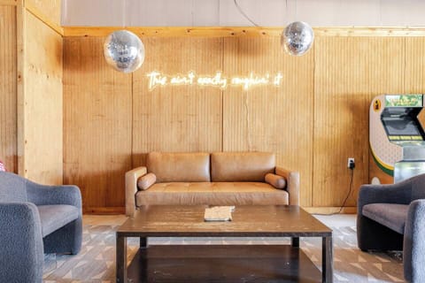 Community game room with arcade games, cards, board games, and ping pong.