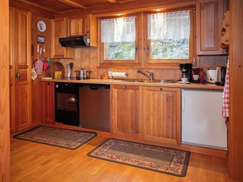 Cabinetry, Furniture, Wood, Kitchen, Countertop, Interior Design, Kitchen Appliance, Flooring, Cupboard, Major Appliance