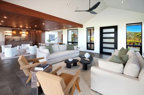 Open-concept living blending clean design and warm island textures.
