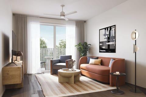 Deluxe 1 Bedroom Suite w/ Balcony: Living room with pull-out couch