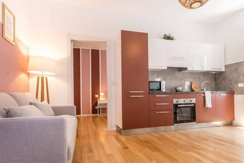 Apartment, 3 Bedrooms | Living area | 32-inch flat-screen TV with cable channels