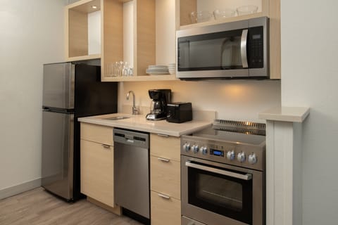 Suite, 1 Bedroom | Private kitchen | Full-size fridge, microwave, stovetop, dishwasher