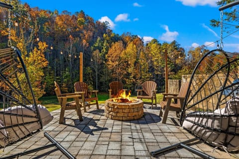Paved patio with firepit and bbq to enjoy the outdoors !