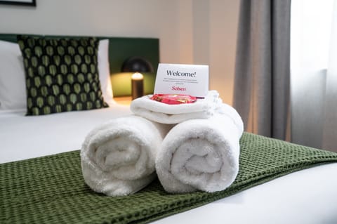 Desk, laptop workspace, blackout drapes, iron/ironing board