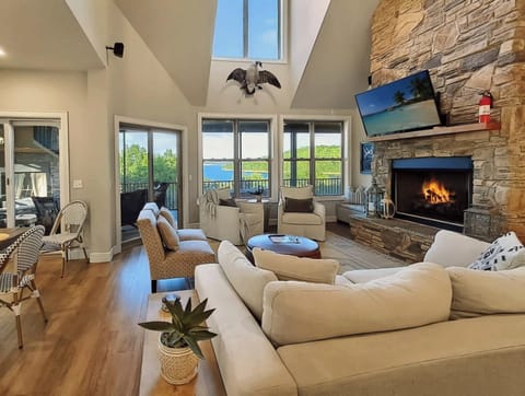Gather around the fireplace and enjoy stunning lake views.