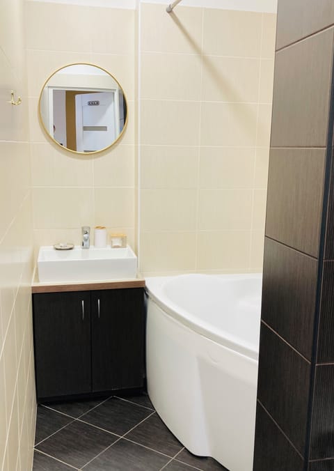 Full bathroom with toilet, bath, shower and curtains. Handmade soap available!