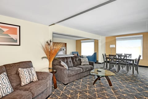 Suite, 1 Bedroom, Courtyard View | Desk, laptop workspace, blackout drapes, iron/ironing board